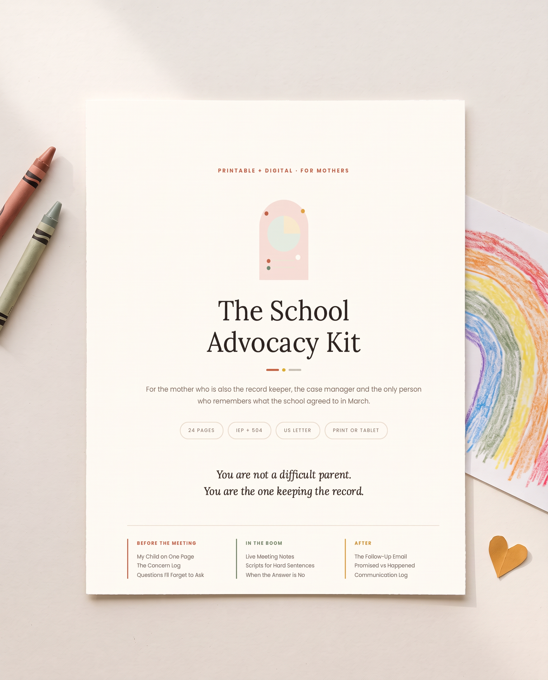 The Mom Advocate school advocacy kit beside a child's rainbow drawing and crayons